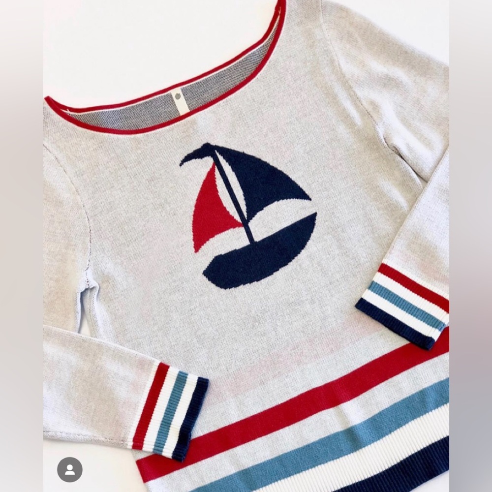 Whimsical sailboat motif on Long sleeve sweater.